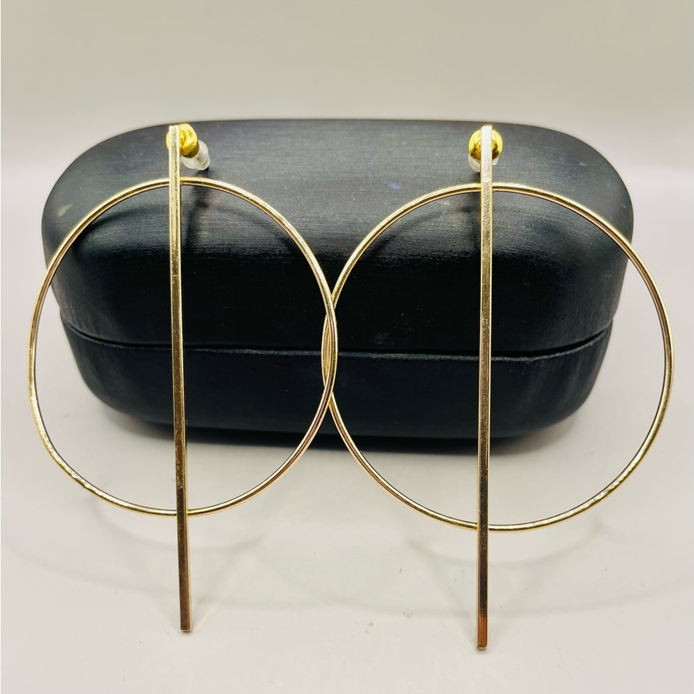 Circle with bar geometric gold tone earrings. Post back for pierced ears. Modern